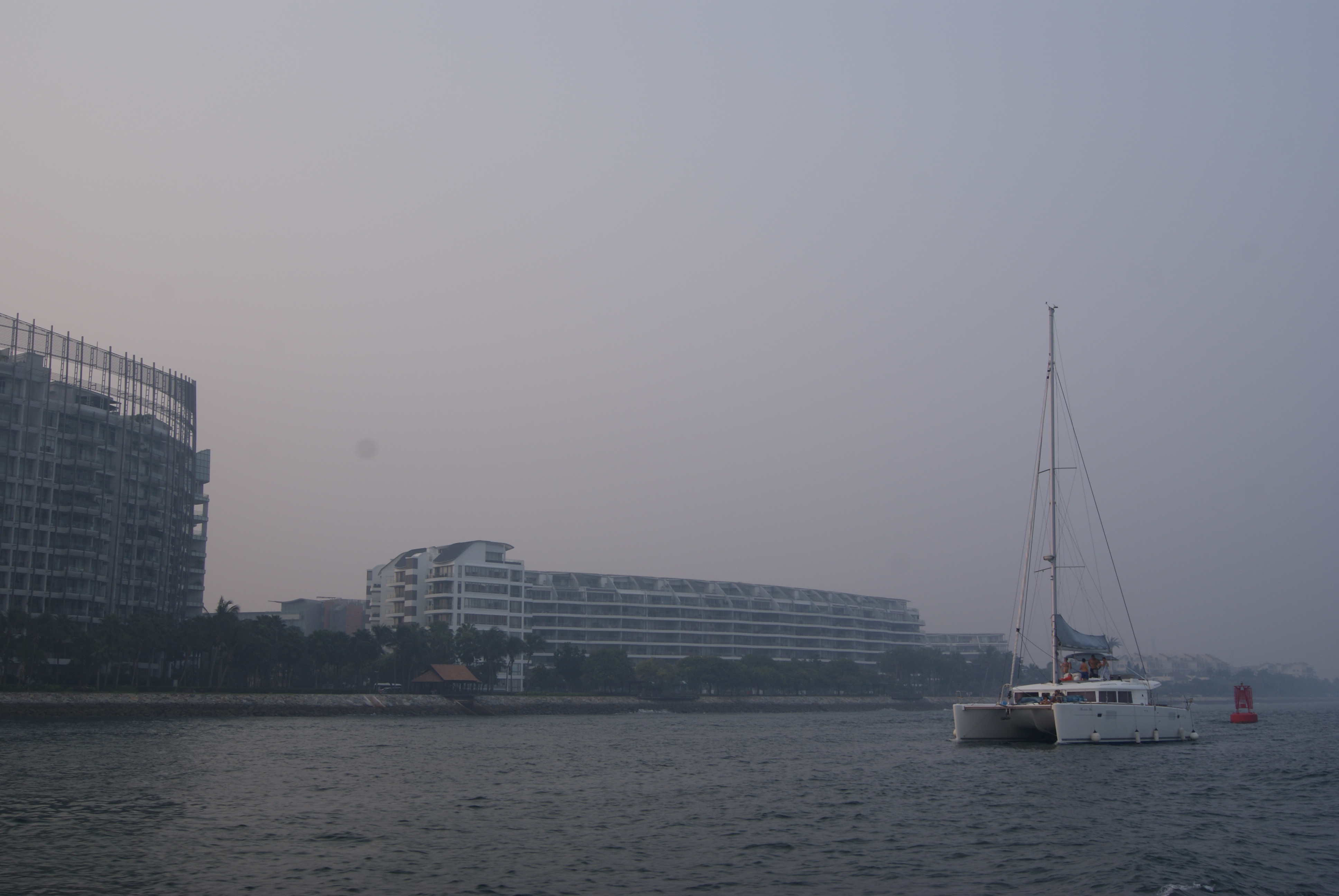 Waterfront residences and a yacht at Sentosa Cove, Singapore.